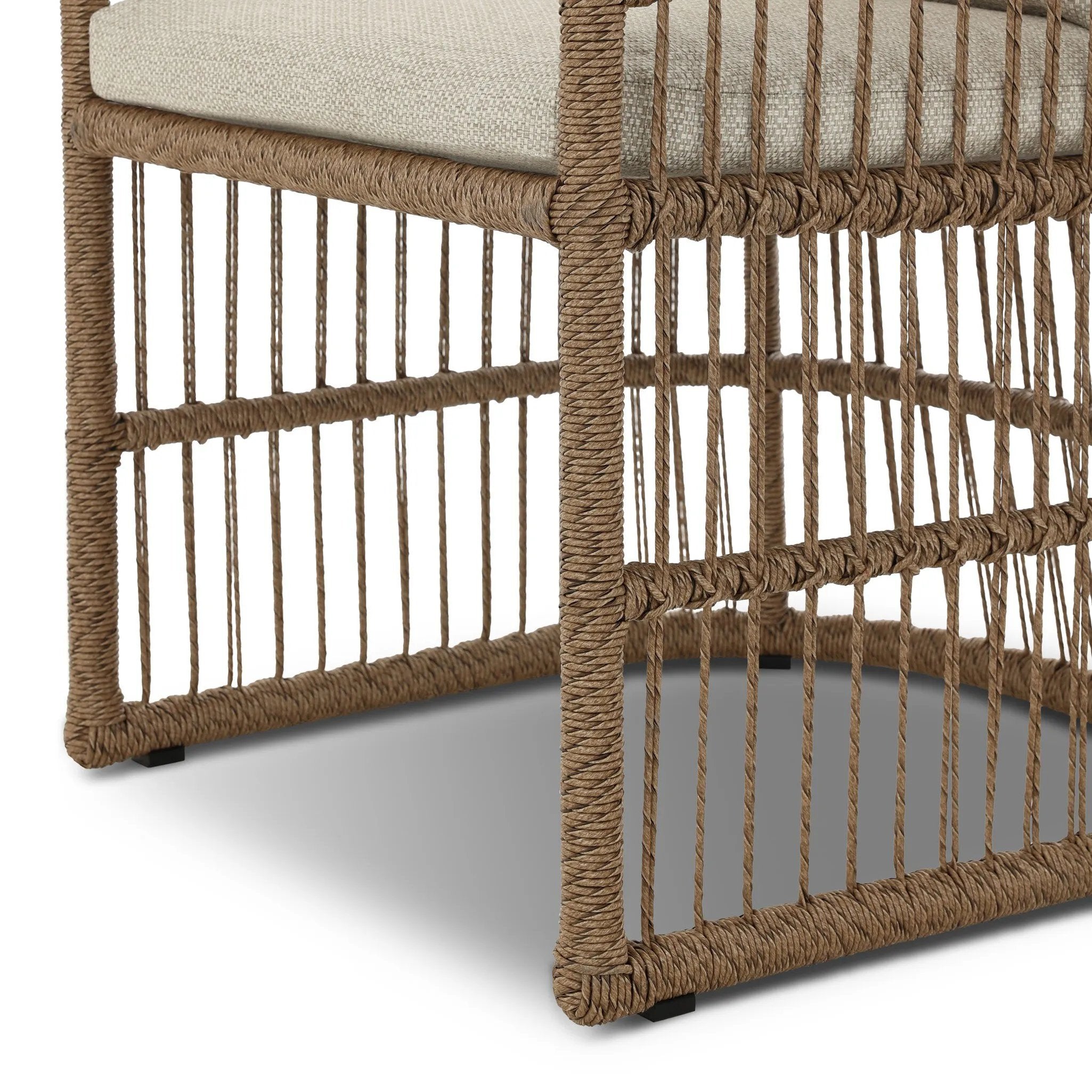 Cottage-inspired, faux hyacinth mimics its natural counterpart, with joint wrapping and texture for depth and character defining this outdoor dining chair. Varied proportion for dimension. Upholstered in a UV-resistant, water-repellent, quick-drying fabric. Cover or store indoors during inclement weather and when not in use Amethyst Home provides interior design, new home construction design consulting, vintage area rugs, and lighting in the Omaha metro area.