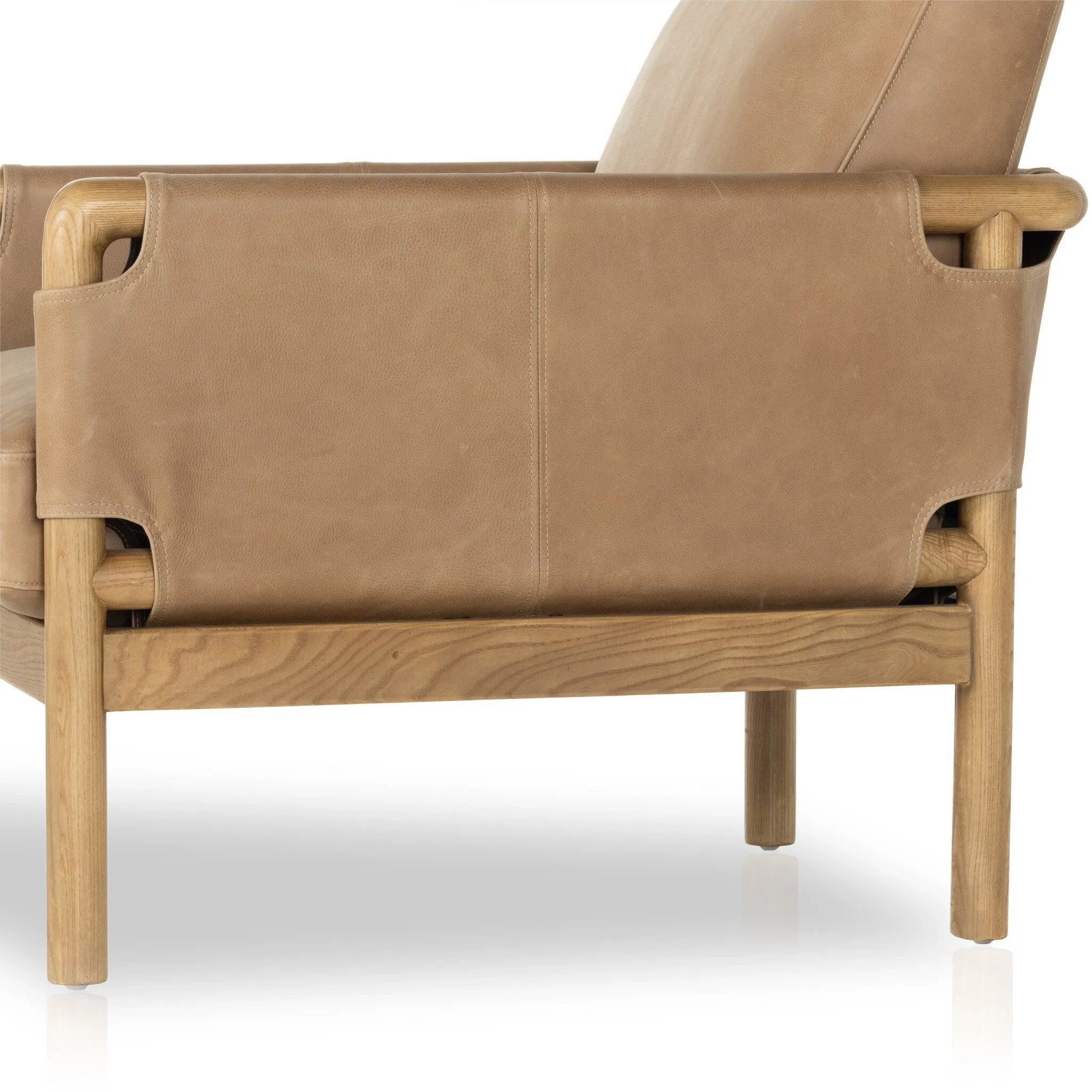 Featuring Navarro Palermo Drift Chair by Four Hands at Amethyst Home. Safari inspiration meets zen aspirations. A cylindrical frame is crafted, smoothed and rounded from solid ash wood. Includes two loose feather-blend cushions covered in subtly distressed thick cut leather in a neutral taupe hue for a monochromatic look. Overall Dimensions: 27.75"w x 34.00"d x. Amethyst Home provides interior design, new home construction design consulting, vintage area rugs, and lighting in the Omaha metro area.