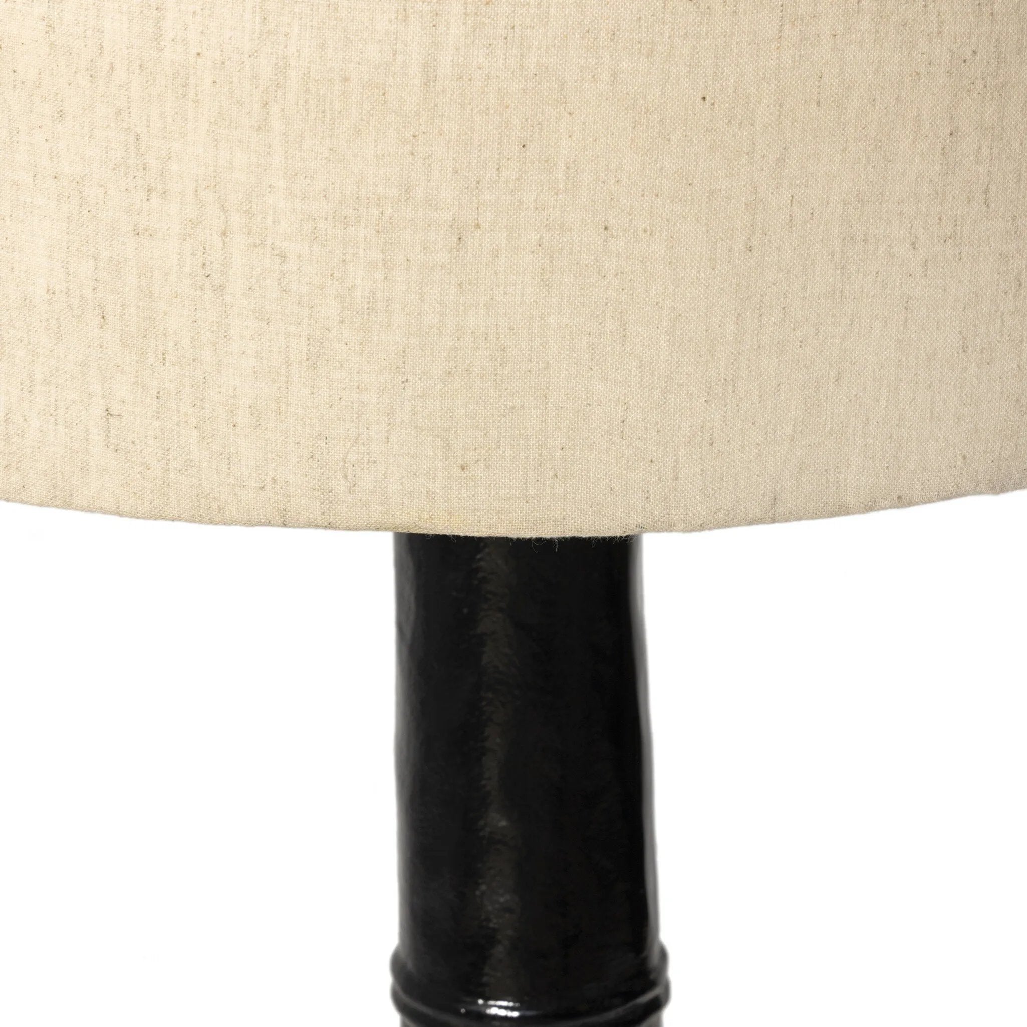 Inspired by a vintage salt shaker found while exploring Copenhagen, Denmark, this glossy cast aluminum lamp has a telescoping shape that's finished with a traditional flax linen shade Amethyst Home provides interior design, new home construction design consulting, vintage area rugs, and lighting in the Dallas metro area.