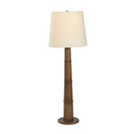 Inspired by a vintage salt shaker found while exploring Copenhagen, Denmark, this warm brown oak floor lamp has a telescoping shape that's finished with a traditional tan linen shade Amethyst Home provides interior design, new home construction design consulting, vintage area rugs, and lighting in the Boston metro area.