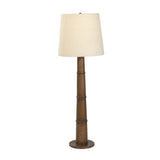 Inspired by a vintage salt shaker found while exploring Copenhagen, Denmark, this warm brown oak floor lamp has a telescoping shape that's finished with a traditional tan linen shade Amethyst Home provides interior design, new home construction design consulting, vintage area rugs, and lighting in the Boston metro area.