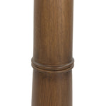 Inspired by a vintage salt shaker found while exploring Copenhagen, Denmark, this warm brown oak floor lamp has a telescoping shape that's finished with a traditional tan linen shade Amethyst Home provides interior design, new home construction design consulting, vintage area rugs, and lighting in the Park City metro area.