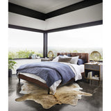 Subtle, modern elegance. A low, tufted headboard in a vintage tobacco faux leather pairs with a simple gunmetal iron base Amethyst Home provides interior design, new home construction design consulting, vintage area rugs, and lighting in the Omaha metro area.