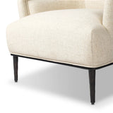 With elements of past eras at play, this updated Deco chair features a rounded back, sloped arms and a dramatic channel. The iron base and tapered legs support the cushiony seat — built with spring suspensions for long-lasting comfort. Amethyst Home provides interior design, new home construction design consulting, vintage area rugs, and lighting in the Scottsdale metro area.