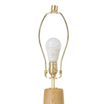 Modern minimal meets traditional. A tapered wood floor lamp base is topped with a design-forward boucle linen shade Amethyst Home provides interior design, new home construction design consulting, vintage area rugs, and lighting in the Seattle metro area.