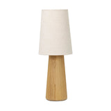 Modern minimal meets traditional. A tapered wood table lamp base is topped with a design-forward boucle linen shade Amethyst Home provides interior design, new home construction design consulting, vintage area rugs, and lighting in the Austin metro area.