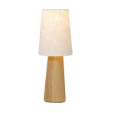 Modern minimal meets traditional. A tapered wood table lamp base is topped with a design-forward boucle linen shade Amethyst Home provides interior design, new home construction design consulting, vintage area rugs, and lighting in the Houston metro area.
