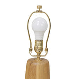 Modern minimal meets traditional. A tapered wood table lamp base is topped with a design-forward boucle linen shade Amethyst Home provides interior design, new home construction design consulting, vintage area rugs, and lighting in the Kansas City metro area.