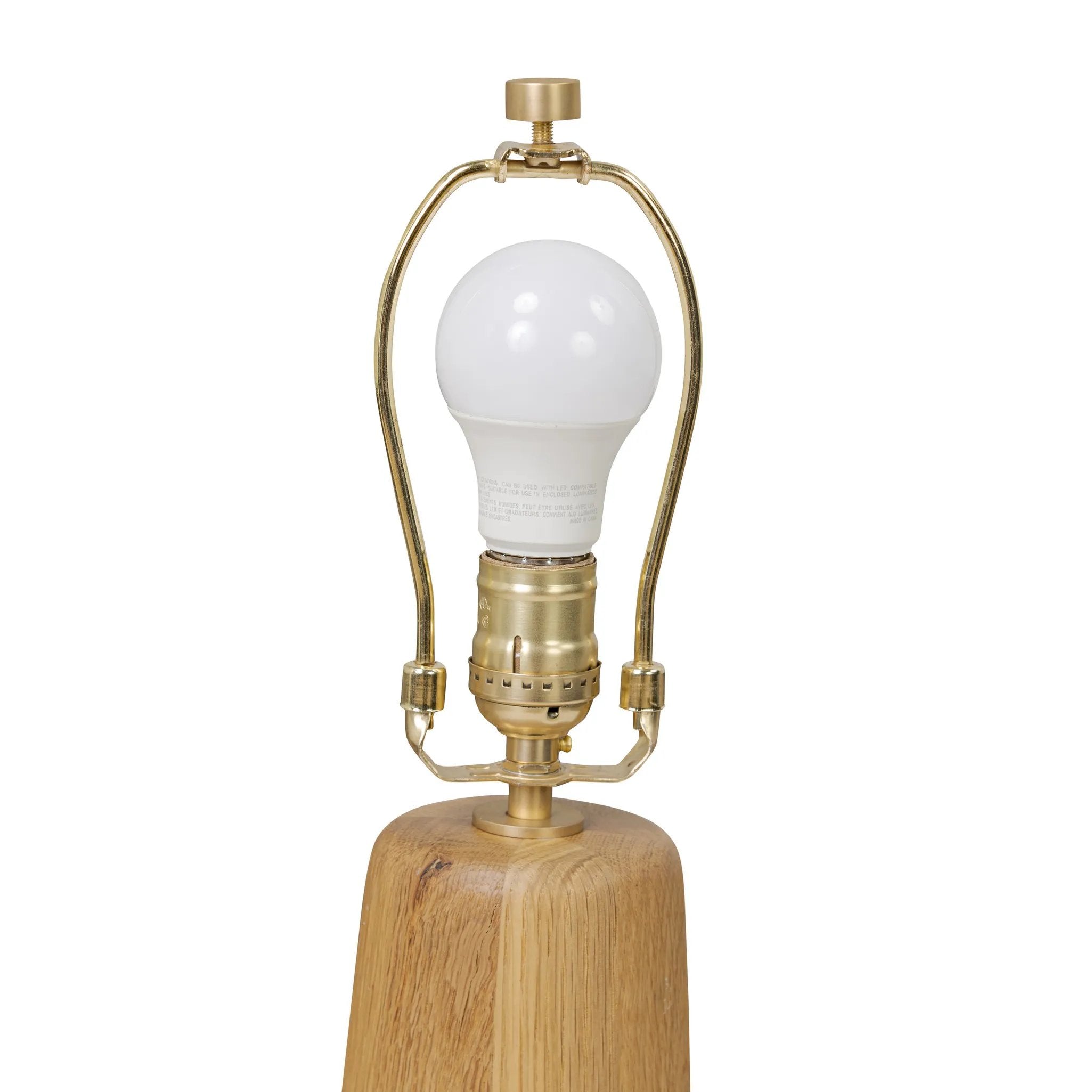 Modern minimal meets traditional. A tapered wood table lamp base is topped with a design-forward boucle linen shade Amethyst Home provides interior design, new home construction design consulting, vintage area rugs, and lighting in the Kansas City metro area.