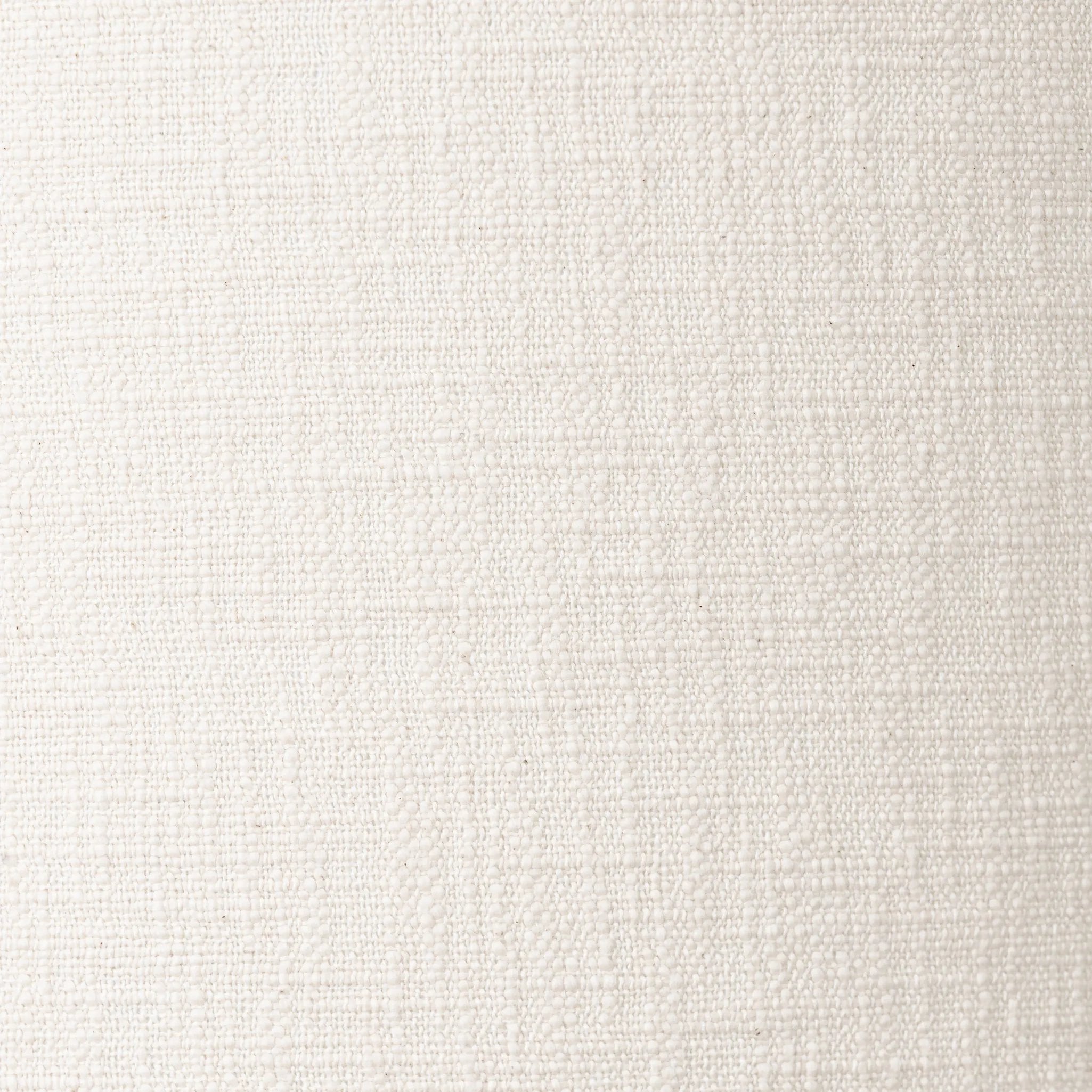 Modern minimal meets traditional. A tapered wood table lamp base is topped with a design-forward boucle linen shade Amethyst Home provides interior design, new home construction design consulting, vintage area rugs, and lighting in the Nashville metro area.