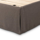 An arched headboard and simple frame act as the perfect canvas for your favorite bedding. A soft textural linen slipcover in a rich brown hue contributes a cozy yet refined look Amethyst Home provides interior design, new home construction design consulting, vintage area rugs, and lighting in the Portland metro area.