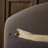 An arched headboard and simple frame act as the perfect canvas for your favorite bedding. A soft textural linen slipcover in a rich brown hue contributes a cozy yet refined look Amethyst Home provides interior design, new home construction design consulting, vintage area rugs, and lighting in the San Diego metro area.