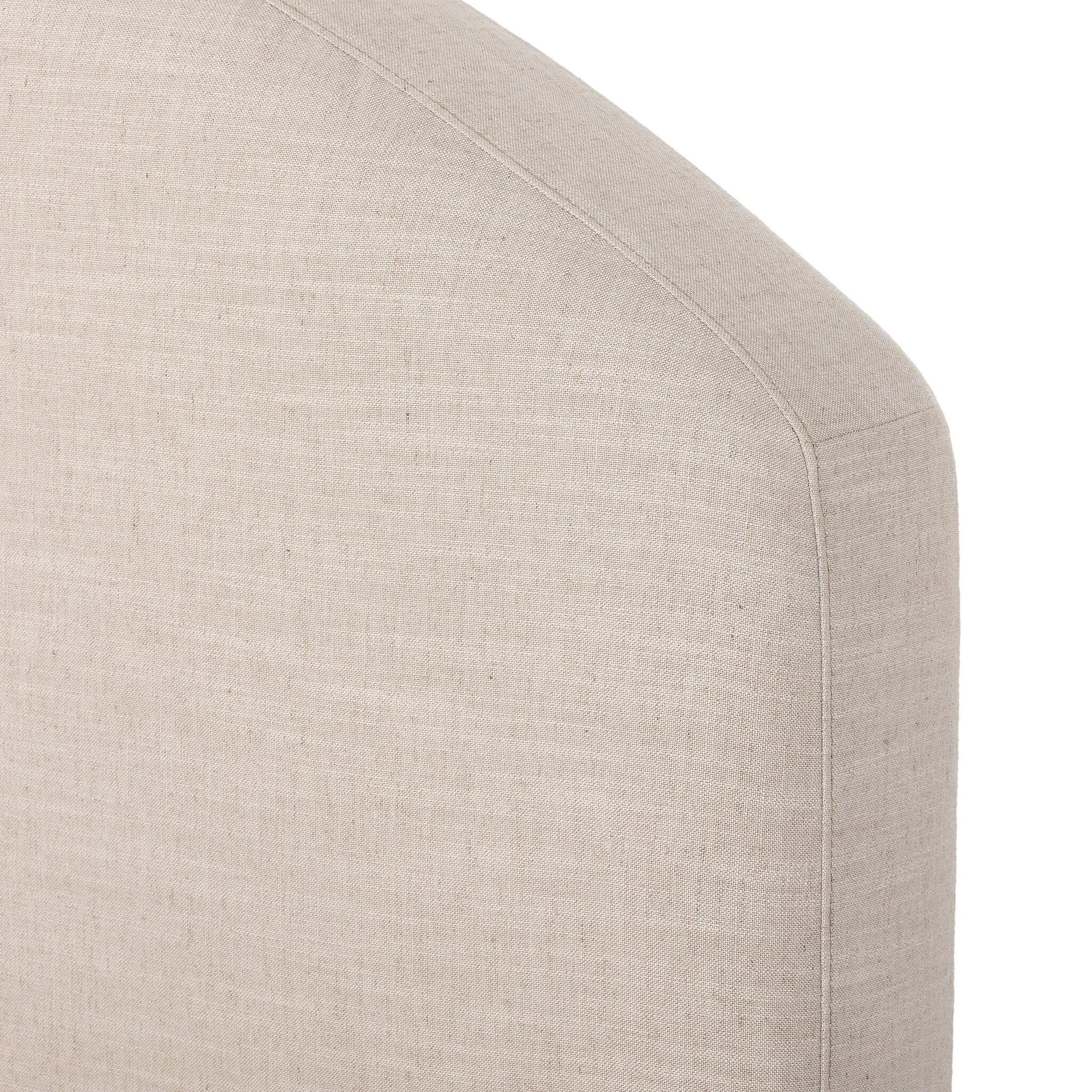 An arched headboard and simple frame act as the perfect canvas for your favorite bedding. A soft textural linen slipcover in a neutral hue contributes a cozy yet refined look Amethyst Home provides interior design, new home construction design consulting, vintage area rugs, and lighting in the Salt Lake City metro area.
