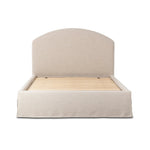 An arched headboard and simple frame act as the perfect canvas for your favorite bedding. A soft textural linen slipcover in a neutral hue contributes a cozy yet refined look Amethyst Home provides interior design, new home construction design consulting, vintage area rugs, and lighting in the Tampa metro area.