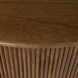 An artisanal take on texture. Made from amber-finished mindi with a plinth-style base, a reeding pattern is carved around the entirety of this coffee table table for a fresh, approachable look.As lovers of natural aesthetics at Amethyst, we love the warm modern inspired Ona Coffee Table - Amber Mindi Veneer. Amethyst Home provides interior design, new home construction design consulting, vintage area rugs, and lighting in the Des Moines metro area.