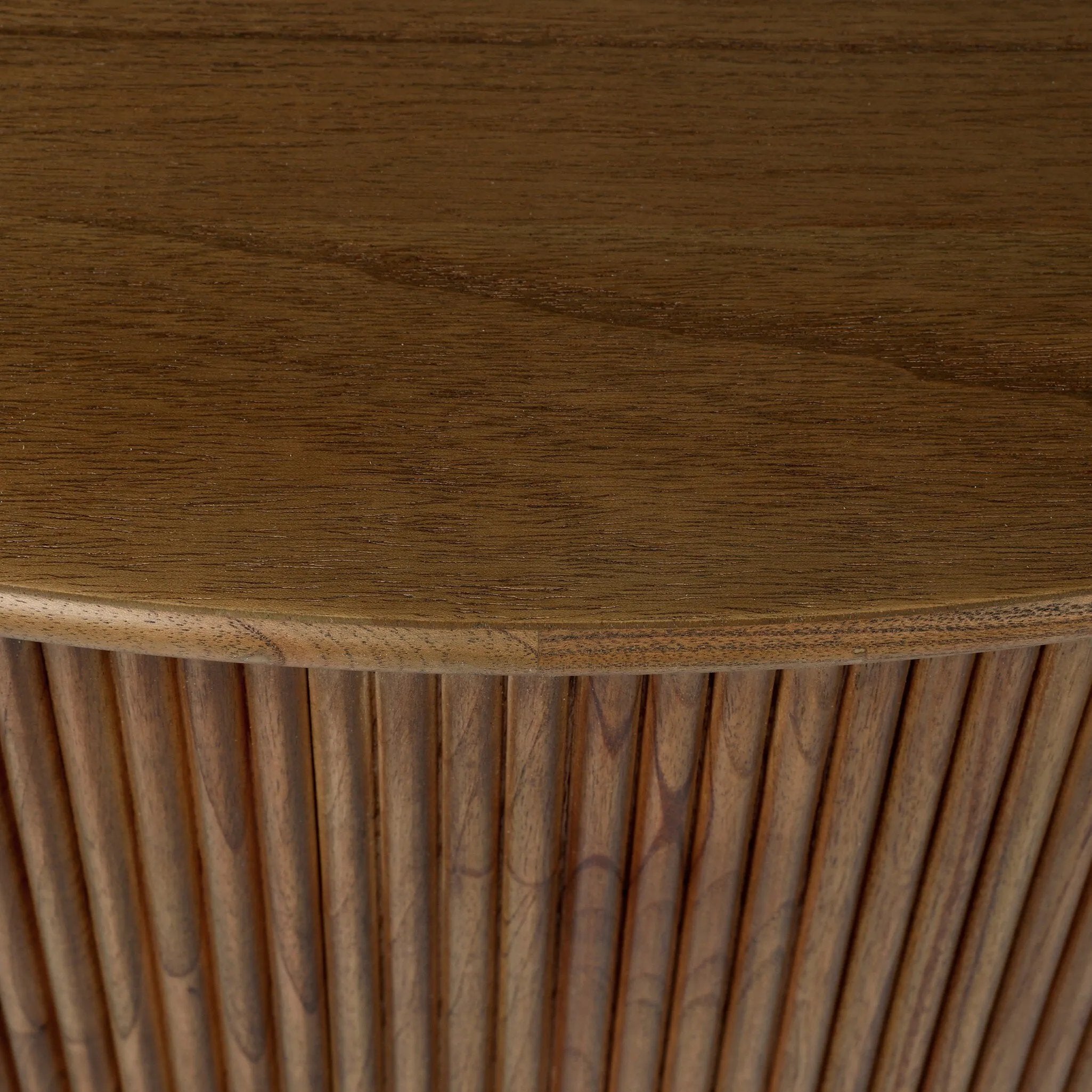 An artisanal take on texture. Made from amber-finished mindi with a plinth-style base, a reeding pattern is carved around the entirety of this coffee table table for a fresh, approachable look.As lovers of natural aesthetics at Amethyst, we love the warm modern inspired Ona Coffee Table - Amber Mindi Veneer. Amethyst Home provides interior design, new home construction design consulting, vintage area rugs, and lighting in the Des Moines metro area.