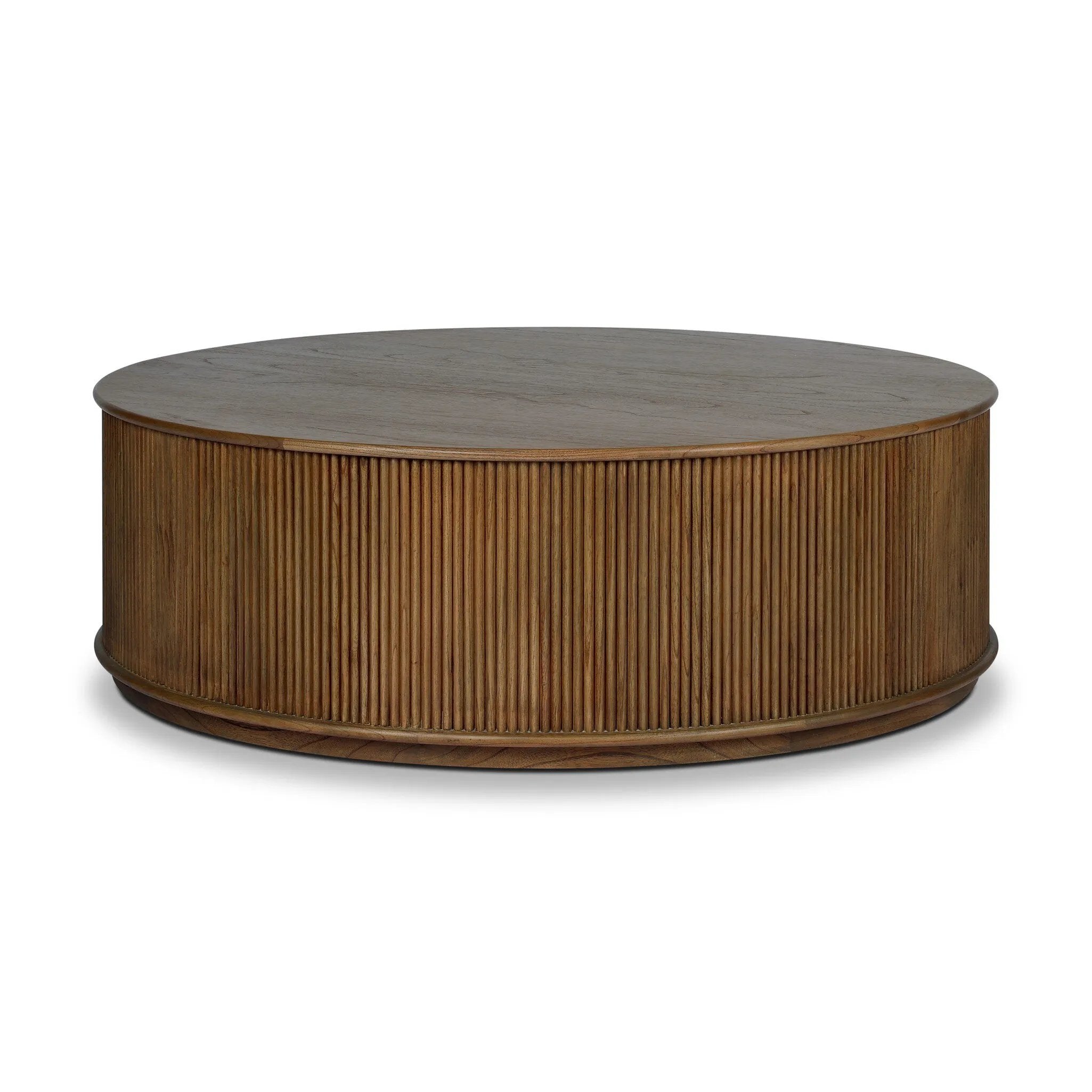 An artisanal take on texture. Made from amber-finished mindi with a plinth-style base, a reeding pattern is carved around the entirety of this coffee table table for a fresh, approachable look.As lovers of natural aesthetics at Amethyst, we love the warm modern inspired Ona Coffee Table - Amber Mindi Veneer. Amethyst Home provides interior design, new home construction design consulting, vintage area rugs, and lighting in the Houston metro area.