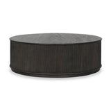An artisanal take on texture. Made from black-finished mindi with a plinth-style base, a reeding pattern is carved around the entirety of this coffee table table for a fresh, approachable look.As fans of clean style at Amethyst, we love the nature inspired Ona Coffee Table - Smoked Black Mindi - Smoked Black Mindi Veneer. Amethyst Home provides interior design, new home construction design consulting, vintage area rugs, and lighting in the Seattle metro area.