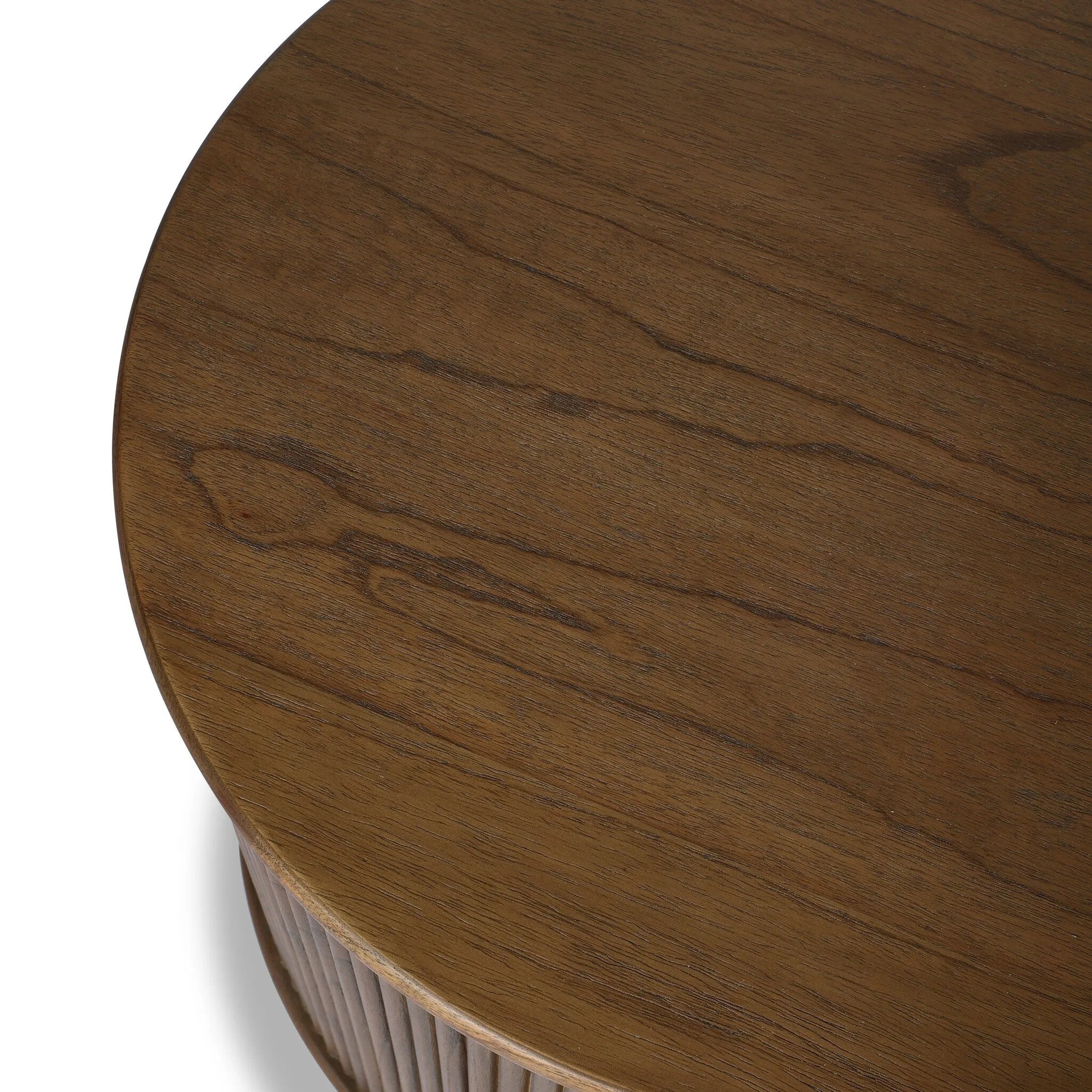 An artisanal take on texture. Made from mindi wood with a plinth-style base, a reeding pattern is carved around the entirety of this versatile end table for a fresh, approachable look.As fans of luxe style at Amethyst, we love the optimistic inspired Ona End Table - Amber Mindi Veneer. Amethyst Home provides interior design, new home construction design consulting, vintage area rugs, and lighting in the Charlotte metro area.