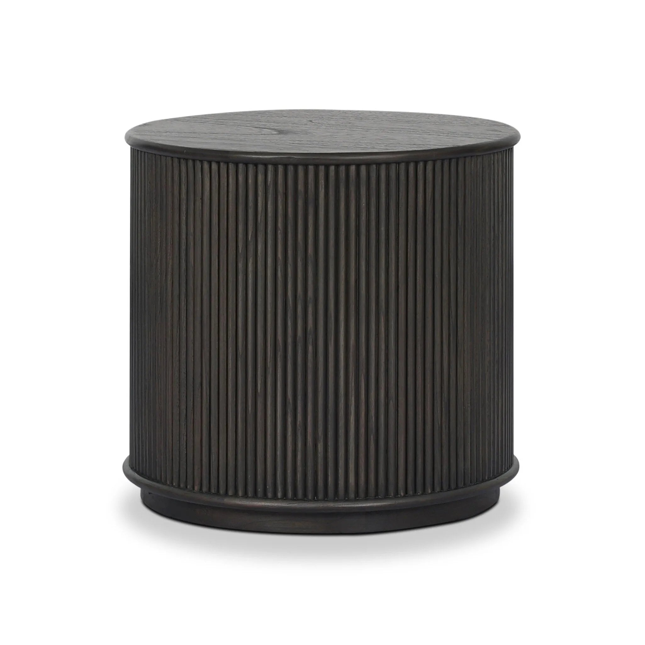 An artisanal take on texture. Made from black-finished mindi wood with a plinth-style base, a reeding pattern is carved around the entirety of this versatile end table for a fresh, approachable look.As lovers of luxe aesthetics at Amethyst, we love the optimistic inspired Ona End Table - Smoked Black Mindi Veneer. Amethyst Home provides interior design, new home construction design consulting, vintage area rugs, and lighting in the Boston metro area.