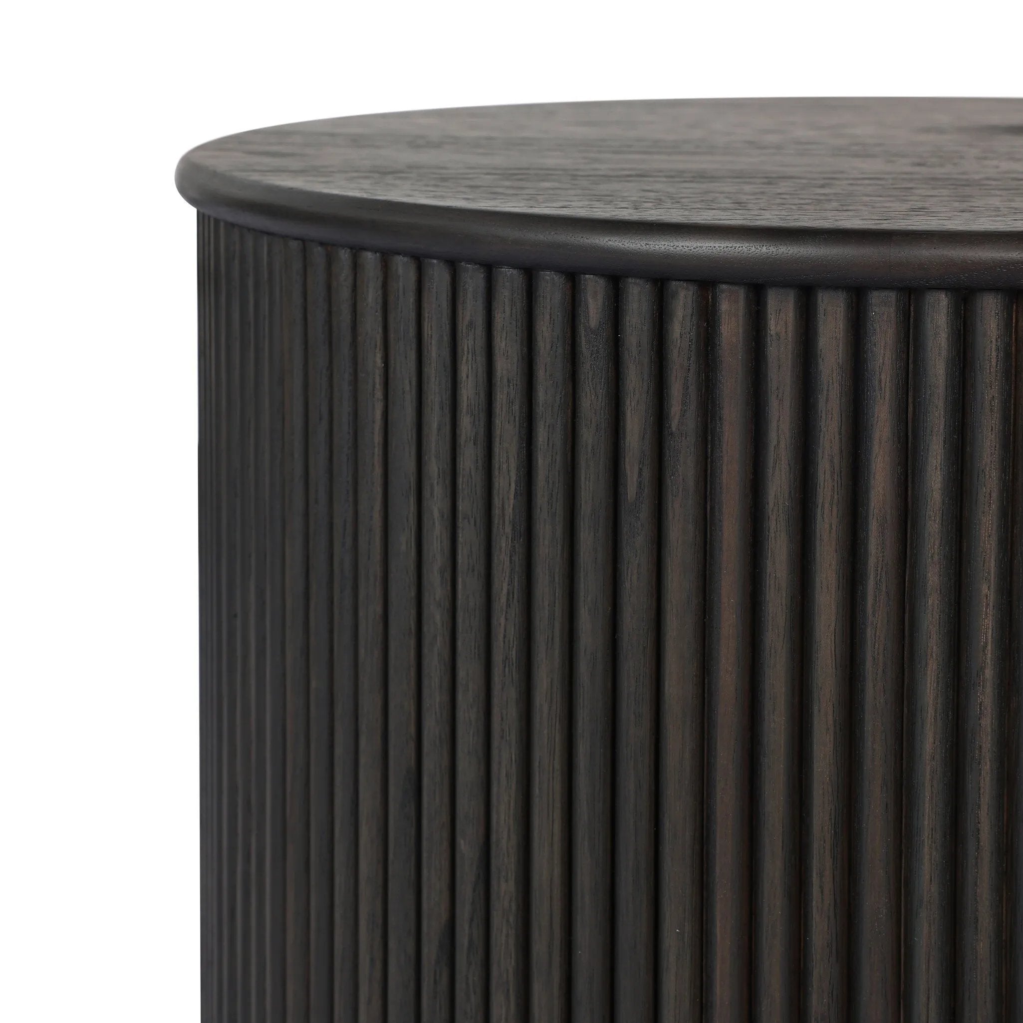 An artisanal take on texture. Made from black-finished mindi wood with a plinth-style base, a reeding pattern is carved around the entirety of this versatile end table for a fresh, approachable look.As lovers of luxe aesthetics at Amethyst, we love the optimistic inspired Ona End Table - Smoked Black Mindi Veneer. Amethyst Home provides interior design, new home construction design consulting, vintage area rugs, and lighting in the Winter Garden metro area.