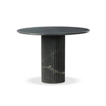 Featuring Oranda Black Marble Round Dining Table by Four Hands at Amethyst Home. Inspired by Italian design, a swirling marble base is scalloped for a linear look with heavy texture, finished with a rounded, bistro-size tabletop of polished black marble.Overall Dimensions: 42.00"w x 42.00"d x 30.00"hWeight : 195.00 lbsMaterials: Solid Marble. Amethyst Home provides interior design, new home construction design consulting, vintage area rugs, and lighting in the Charlotte metro area.