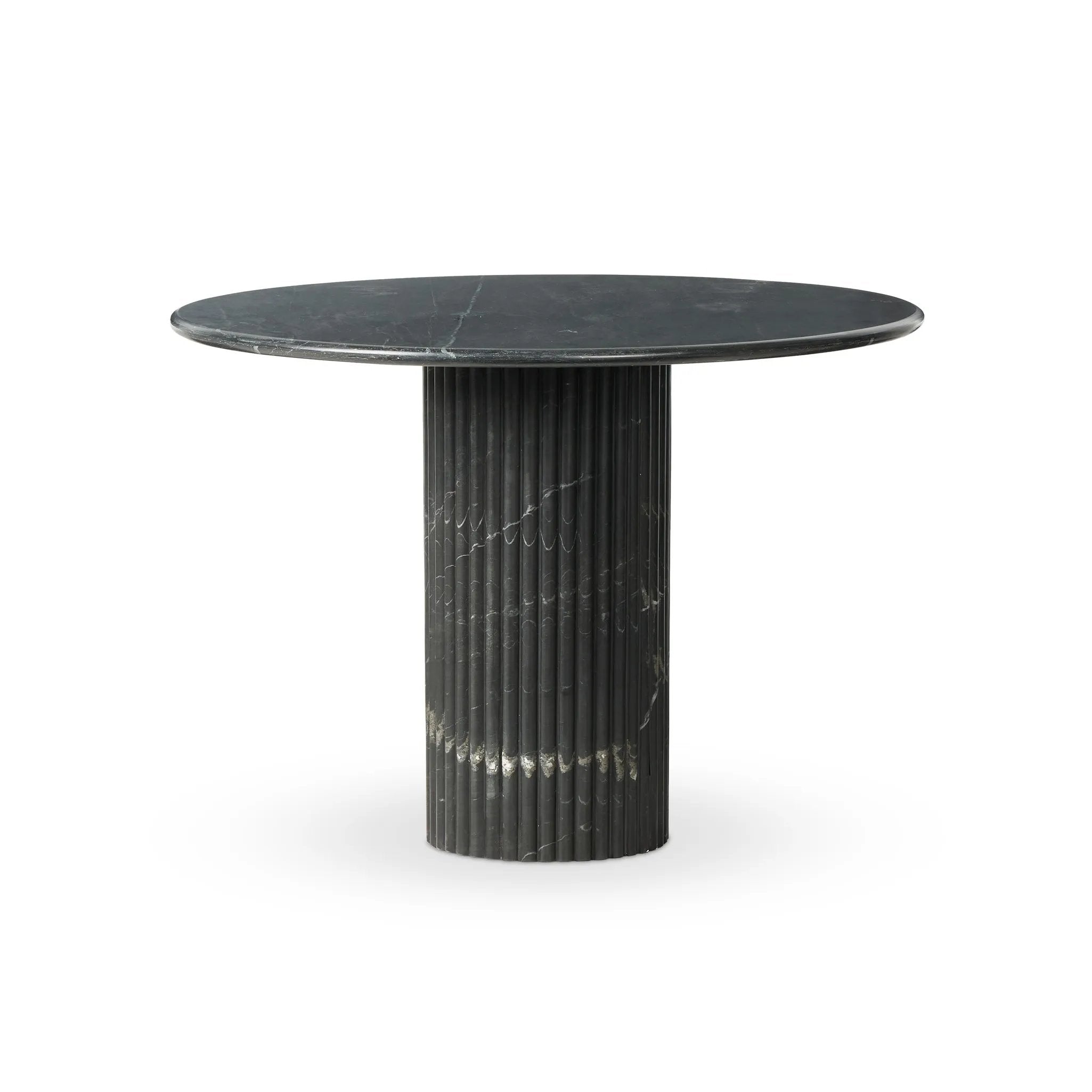 Featuring Oranda Black Marble Round Dining Table by Four Hands at Amethyst Home. Inspired by Italian design, a swirling marble base is scalloped for a linear look with heavy texture, finished with a rounded, bistro-size tabletop of polished black marble.Overall Dimensions: 42.00"w x 42.00"d x 30.00"hWeight : 195.00 lbsMaterials: Solid Marble. Amethyst Home provides interior design, new home construction design consulting, vintage area rugs, and lighting in the Scottsdale metro area.