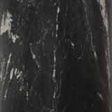 A material-driven piece inspired by post-modernism. A subtly organic round tabletop pairs with a swooped, sculptural pedestal base. Made from black marble for a striking, timeless look, with contrasting white veining playing up this piece's curves.As enthusiasts of luxe aesthetics at Amethyst, we love the designer inspired Oric Bistro Table. Amethyst Home provides interior design, new home construction design consulting, vintage area rugs, and lighting in the Austin metro area.