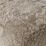 Featuring Oslo Taupe Shearling Ottoman by Four Hands at Amethyst Home. A subtle sweetheart shape paired with beige shearling plays into this ottoman's found object appeal. S-spring suspension offers a comfy place to sit and the shearling upholstery brings depth and vintage vibes throughout. Perfect styled alone or as part of a set for added drama. A design co. Amethyst Home provides interior design, new home construction design consulting, vintage area rugs, and lighting in the Houston metro area.