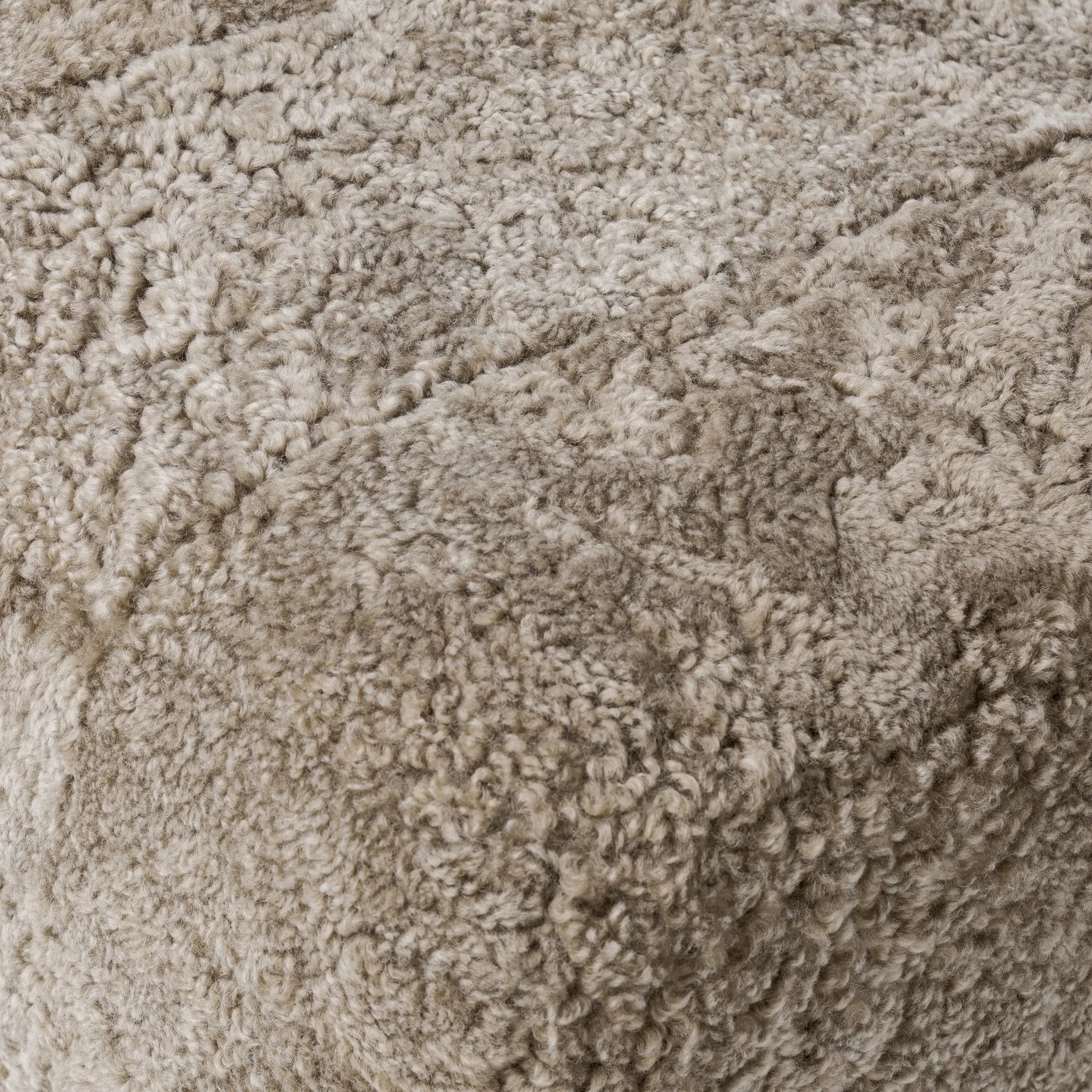 Featuring Oslo Taupe Shearling Ottoman by Four Hands at Amethyst Home. A subtle sweetheart shape paired with beige shearling plays into this ottoman's found object appeal. S-spring suspension offers a comfy place to sit and the shearling upholstery brings depth and vintage vibes throughout. Perfect styled alone or as part of a set for added drama. A design co. Amethyst Home provides interior design, new home construction design consulting, vintage area rugs, and lighting in the Houston metro area.