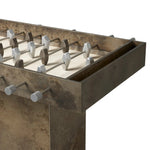 Inspired by Brutalist design, this outdoor foosball table is constructed of industrial oxidized aluminum panels, framing a travertine play surface atop a monolith plinth base that highlights the character of the finish. Two-toned players are cast in solid aluminum. Cover or store indoors during inclement weather and when not in use. Amethyst Home provides interior design, new home construction design consulting, vintage area rugs, and lighting in the Charlotte metro area.