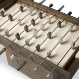 Inspired by Brutalist design, this outdoor foosball table is constructed of industrial oxidized aluminum panels, framing a travertine play surface atop a monolith plinth base that highlights the character of the finish. Two-toned players are cast in solid aluminum. Cover or store indoors during inclement weather and when not in use. Amethyst Home provides interior design, new home construction design consulting, vintage area rugs, and lighting in the Salt Lake City metro area.