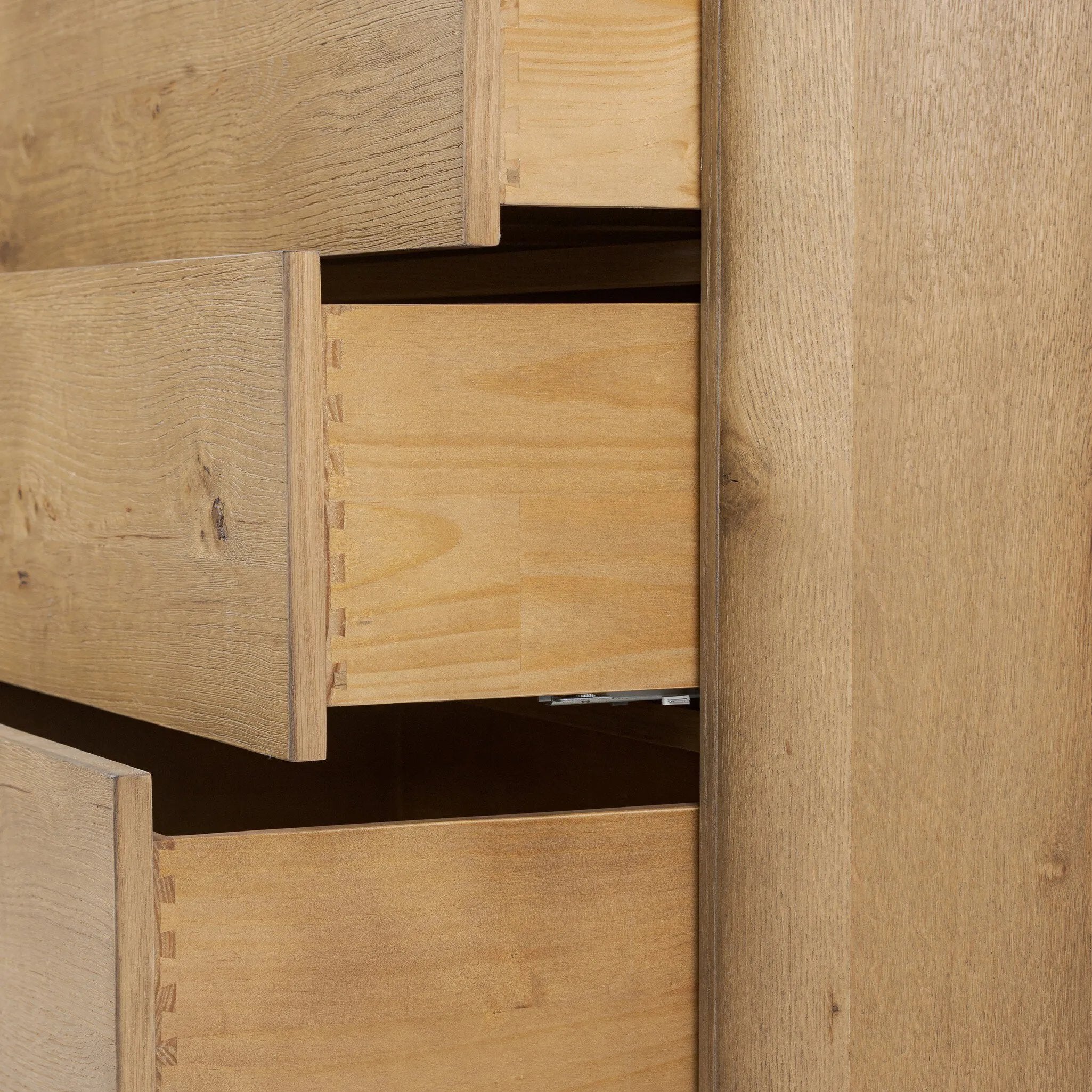 Light, worn oak forms a pedestal base, bringing gentle curves to a classic dresser shape. Six drawers bring spacious storage to the bedroom Amethyst Home provides interior design, new home construction design consulting, vintage area rugs, and lighting in the Omaha metro area.