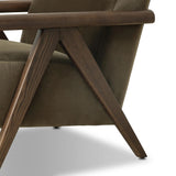 Contemporary outfitting of a vintage chair design offers easy comfort. Upholstered in velvety olive green, the wooden frame is finished in a vintage ash hue. Ideally placed as an accent chair or in pairs Amethyst Home provides interior design, new home construction design consulting, vintage area rugs, and lighting in the Des Moines metro area.