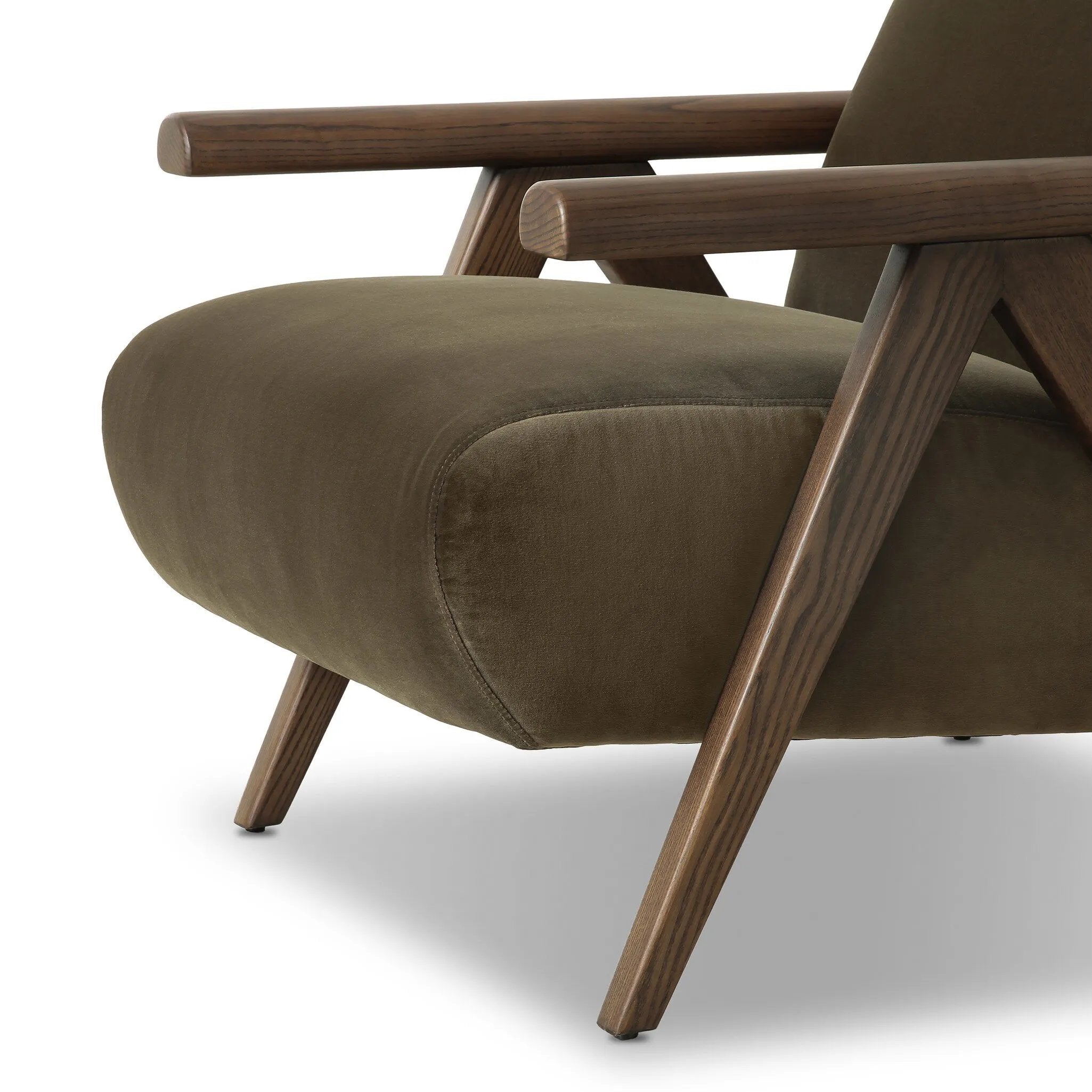 Contemporary outfitting of a vintage chair design offers easy comfort. Upholstered in velvety olive green, the wooden frame is finished in a vintage ash hue. Ideally placed as an accent chair or in pairs Amethyst Home provides interior design, new home construction design consulting, vintage area rugs, and lighting in the Washington metro area.