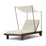 Drawing inspiration from antique rickshaws, this outdoor chaise features wheels and a built-in handle at the front for easy mobility. The adjustable and removable shade canopy offers customizable sun protection, with style. Cover or store inside during inclement weather and when not in use. Amethyst Home provides interior design, new home construction design consulting, vintage area rugs, and lighting in the Tampa metro area.