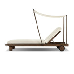 Drawing inspiration from antique rickshaws, this outdoor chaise features wheels and a built-in handle at the front for easy mobility. The adjustable and removable shade canopy offers customizable sun protection, with style. Cover or store inside during inclement weather and when not in use. Amethyst Home provides interior design, new home construction design consulting, vintage area rugs, and lighting in the Winter Garden metro area.