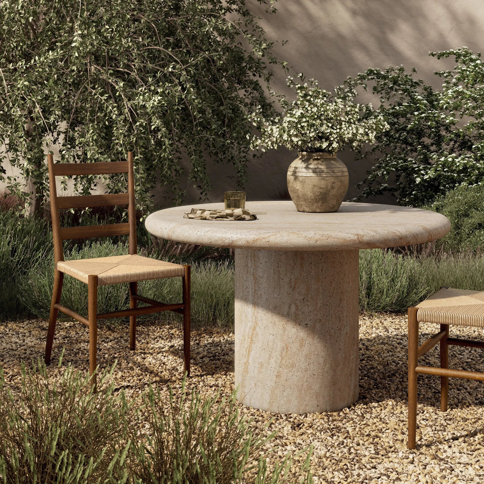 A simple pedestal shape lets the material do the talking on this outdoor dining table. Textured sand concrete resembles natural stone, with lots of natural texture and a beautiful, marble look. Cover or store indoors during inclement weather and when not in use Amethyst Home provides interior design, new home construction design consulting, vintage area rugs, and lighting in the Miami metro area.