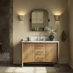 A simple transitional shape designed to function across styles. This bath vanity nods to heritage designs with the softly shaped backsplash, dowel legs, rounded corners and arch frame detail, finished with mixed hardware for added visual interest. Finished with a bath-safe sealant for moisture resistance. Amethyst Home provides interior design, new home construction design consulting, vintage area rugs, and lighting in the Austin metro area.