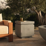 This outdoor propane tank enclosure pairs with fire tables for a clean, seamless look. Made from glass-reinforced concrete, each piece is naturally finished with deep tones of pewter and dark grey. It can act as an end table with its lid on, and has cutouts at the base for hose attachments. Amethyst Home provides interior design, new home construction design consulting, vintage area rugs, and lighting in the Seattle metro area.
