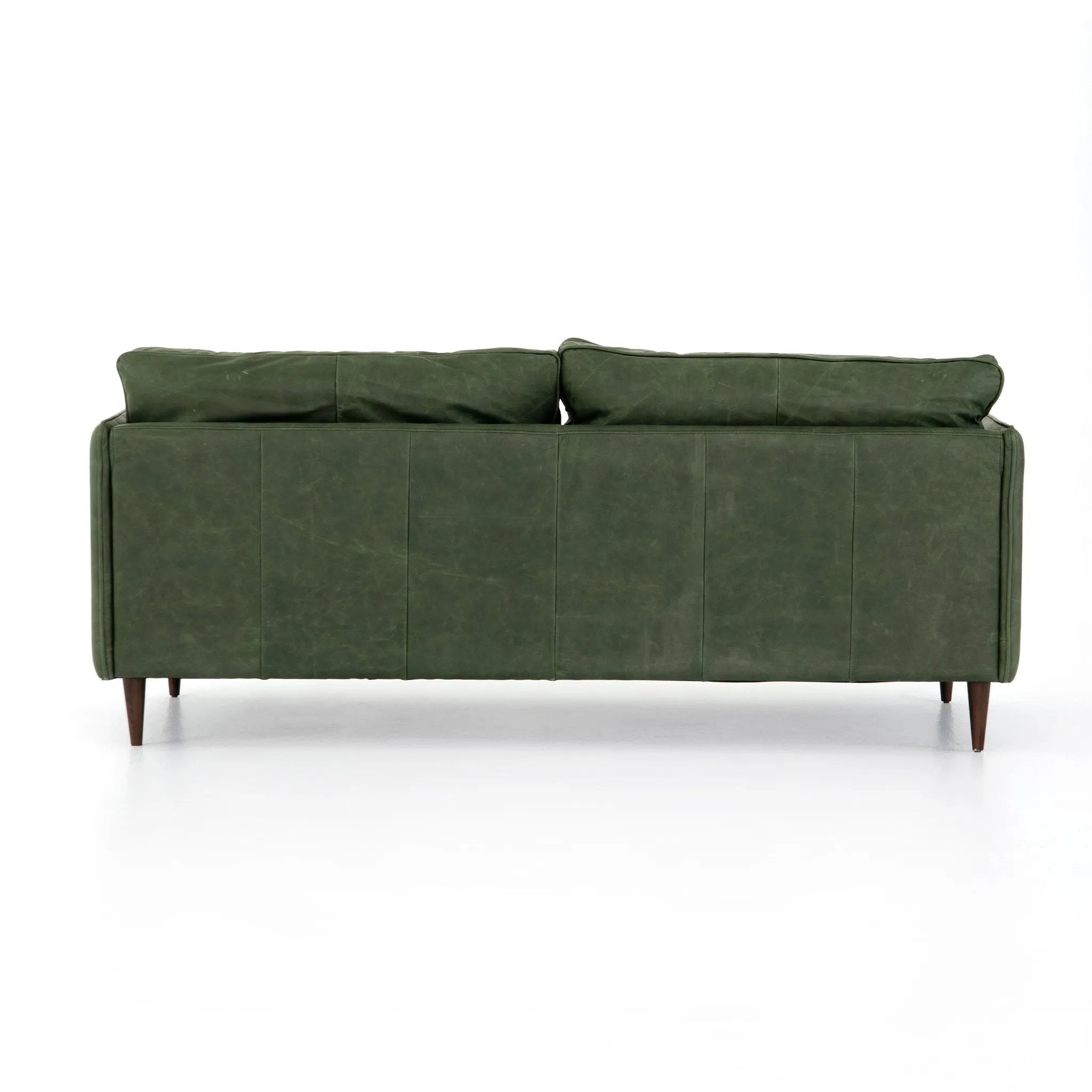 Featuring Reese Eden Sage Sofa by Four Hands at Amethyst Home. Effortlessly on-trend. Two-cushion seating of sage top-grain leather, with knife-edge pillows and welted track arms. Almond-finished legs taper for a modern touch atop mid-century influence.Overall Dimensions: 76.00"w x 35.00"d x 32.75"hWeight : 110.89 lbsMaterials: Top Grain Leather, Poplar Plyw. Amethyst Home provides interior design, new home construction design consulting, vintage area rugs, and lighting in the Monterey metro area.