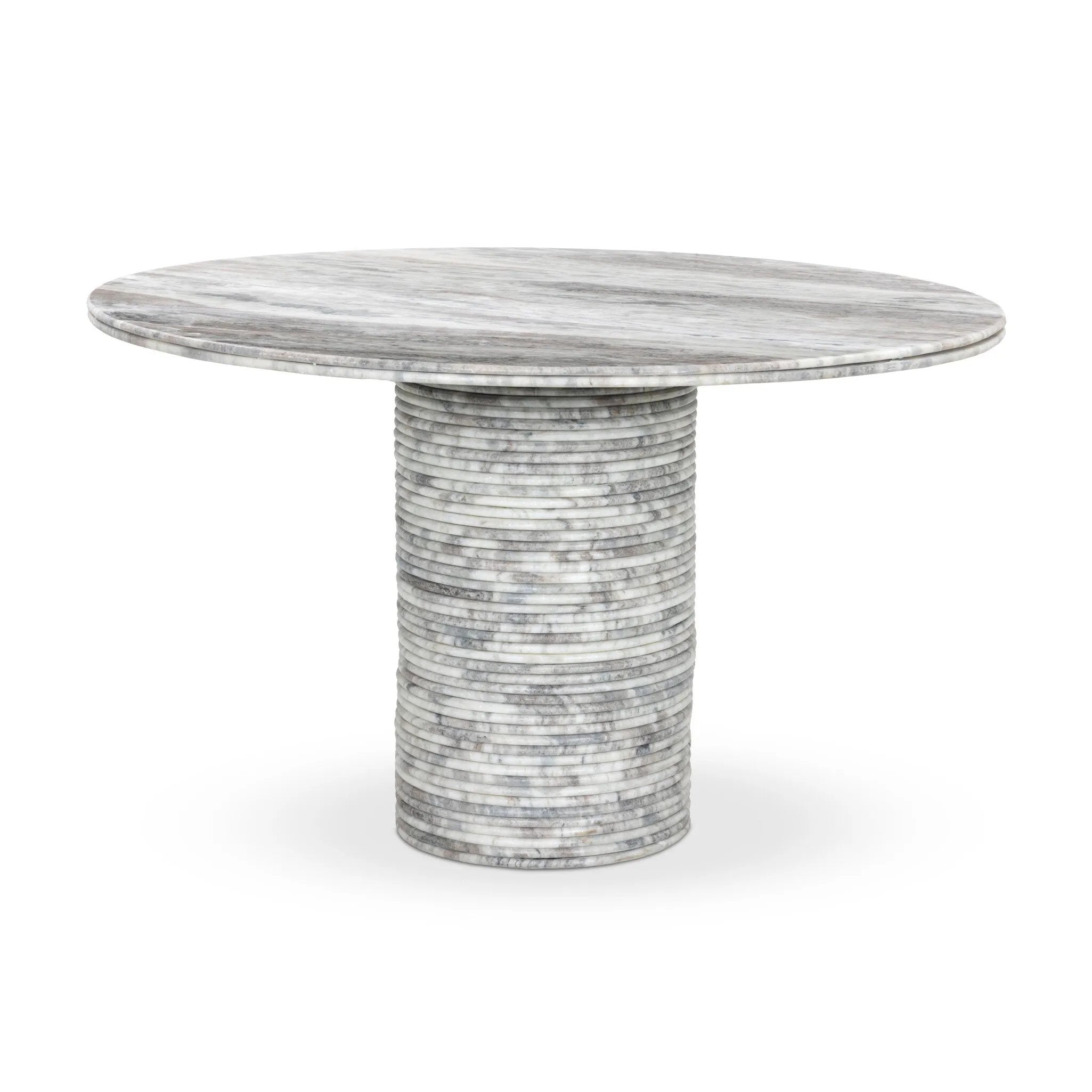 A bold, sculptural presence with movement throughout. This solid marble table features a stacked fluted base and bullnose-edged top that combine to let the natural variation of the material take center stage.As fans of clean design at Amethyst, we love the nature inspired Reeves Dining Table - River Grey Marble. Amethyst Home provides interior design, new home construction design consulting, vintage area rugs, and lighting in the Kansas City metro area.