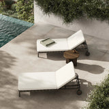 Featuring Reine Alessi Linen Outdoor Chaise by Four Hands at Amethyst Home. A campaign-inspired outdoor chaise transforms any space into your personal retreat. Monochromatic strap detailing wraps a sleek, minimalist frame, with a linen-like cushion upholstered in high-performance Italian fabric. Designed to elevate your outdoor space with a resort-like eas. Amethyst Home provides interior design, new home construction design consulting, vintage area rugs, and lighting in the Alpharetta metro area.