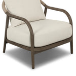 Capturing the ease of tropical ratan seating, an oversized outdoor chair is shaped from FSC-certified teak and wrapped with rush cord detailing. Exemplary woodworking is seen in the fluid lines that end with sturdy spindle legs supporting the comfortable S-spring fixed seat and loose cushion, upholstered in taupe burlap fabric. Amethyst Home provides interior design, new home construction design consulting, vintage area rugs, and lighting in the Houston metro area.