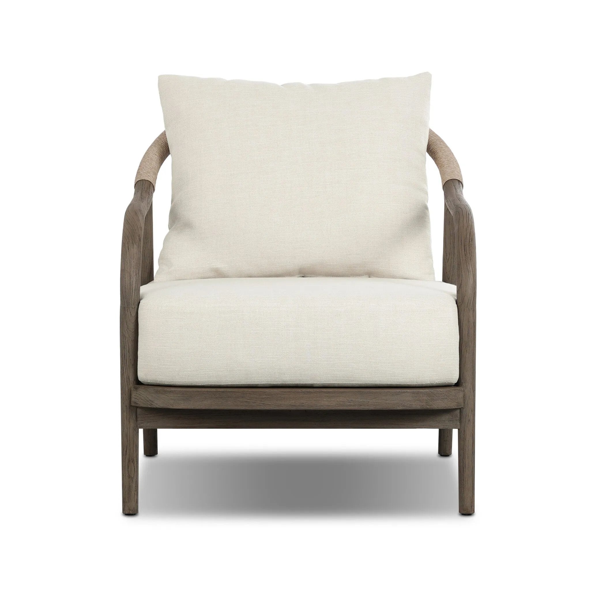 Capturing the ease of tropical ratan seating, an oversized outdoor chair is shaped from FSC-certified teak and wrapped with rush cord detailing. Exemplary woodworking is seen in the fluid lines that end with sturdy spindle legs supporting the comfortable S-spring fixed seat and loose cushion, upholstered in taupe burlap fabric. Amethyst Home provides interior design, new home construction design consulting, vintage area rugs, and lighting in the Newport Beach metro area.