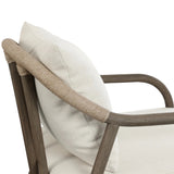 Capturing the ease of tropical ratan seating, an oversized outdoor chair is shaped from FSC-certified teak and wrapped with rush cord detailing. Exemplary woodworking is seen in the fluid lines that end with sturdy spindle legs supporting the comfortable S-spring fixed seat and loose cushion, upholstered in taupe burlap fabric. Amethyst Home provides interior design, new home construction design consulting, vintage area rugs, and lighting in the Park City metro area.