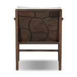 Inset panels of solid teak root are laminated to create a mosaic look against beautiful natural graining. Between angled armrests, cushioned seating is upholstered in a durable Italian fabric for an elevated look with a linen hand feel. Amethyst Home provides interior design, new home construction design consulting, vintage area rugs, and lighting in the Boston metro area.