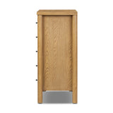 Create storage space in the bedroom with a five-drawer dresser of amber-finished oak. Chunky dowel legs support a tall silhouette and overhang top, all finished out with simple gunmetal hardware Amethyst Home provides interior design, new home construction design consulting, vintage area rugs, and lighting in the Winter Garden metro area.