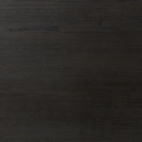 Create storage space in the bedroom with a five-drawer dresser of ebony-finished oak. Chunky dowel legs support a tall silhouette and overhang top, all finished out with simple gunmetal hardware Amethyst Home provides interior design, new home construction design consulting, vintage area rugs, and lighting in the Alpharetta metro area.