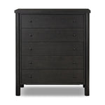 Create storage space in the bedroom with a five-drawer dresser of ebony-finished oak. Chunky dowel legs support a tall silhouette and overhang top, all finished out with simple gunmetal hardware Amethyst Home provides interior design, new home construction design consulting, vintage area rugs, and lighting in the Omaha metro area.